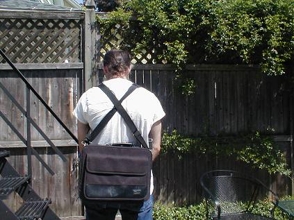 Modify your laptop bag to rest on your back, rather than your side