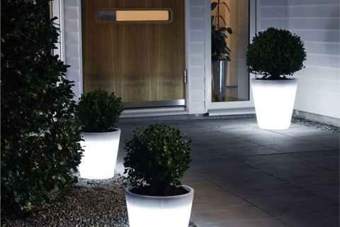 Assisi LED Planter lights your way through a nighttime garden