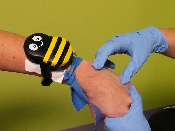 Buzzy is a tourniquet for kids that will take away the sting from shots