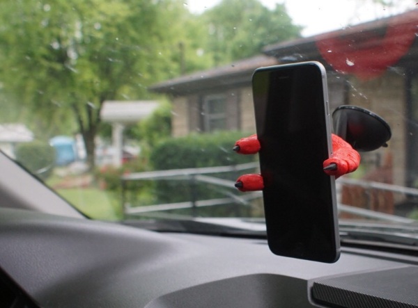 The Claw – the phone holder for people who like watching giant lizards destroy Tokyo